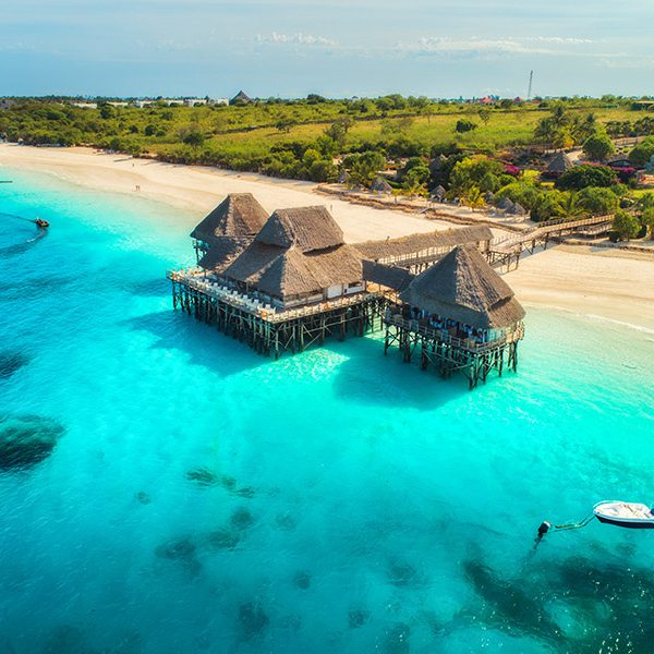 Aerial,View,Of,Beautiful,Hotel,In,Indian,Ocean,At,Sunset